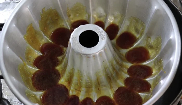 Pour the blended mixture over the caramel in the mold.
