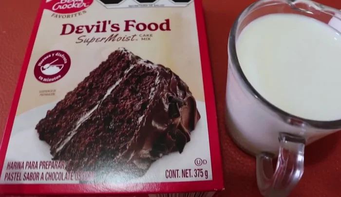 Prepare the chocolate cake batter: In a mixer, beat 3 eggs (room temperature) for 4-5 minutes on high speed. Gradually add vegetable oil, then flour and milk alternately, mixing until smooth.