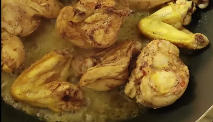 Cook the chicken until it's no longer releasing blood (about 15-20 minutes), adding more water if needed.