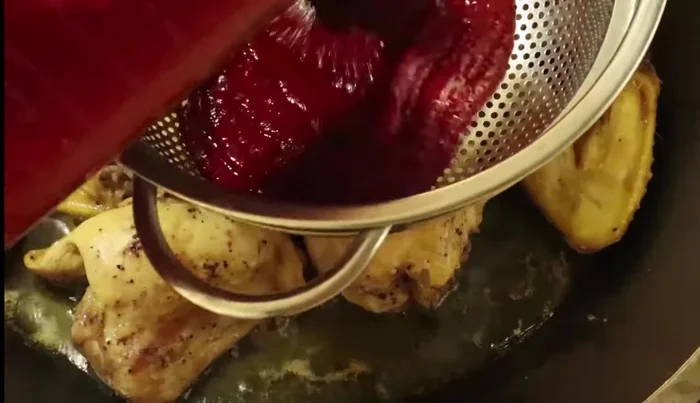 Add the strained chili marinade to the cooked chicken. Stir to coat.
