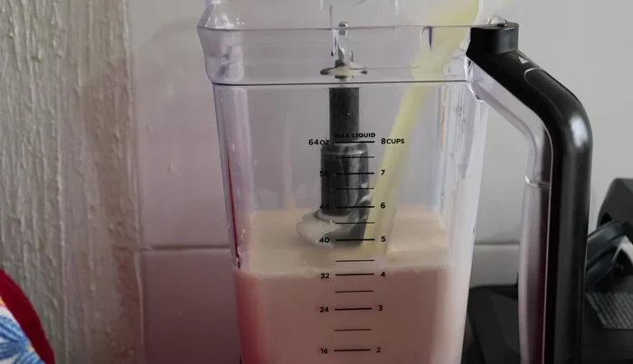 Combine three milk mixture and neutral gelatin: Add the melted gelatin to the three milk mixture in the blender and mix.