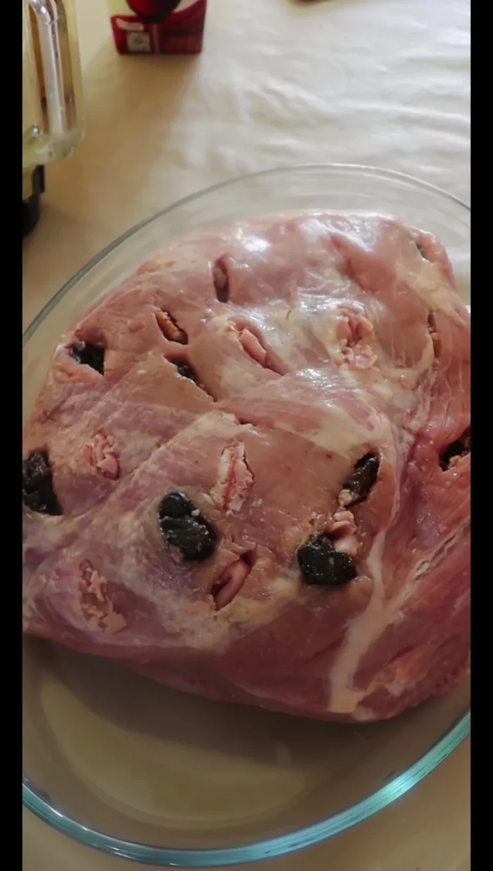 Place the stuffed leg of lamb in a roasting pan. Pour the blended mixture over the leg.