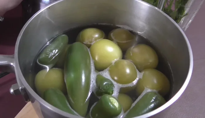 Blend the cooked green tomatoes, chilies, cilantro, and a cup of water until smooth. Add salt to taste.