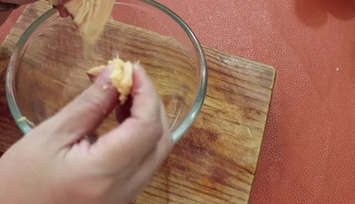 Prepare the chicken breast: cook, then shred.