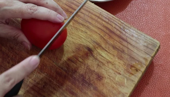 Slice a tomato for garnish.