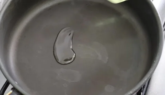 In a frying pan, sauté the chopped onion until translucent.