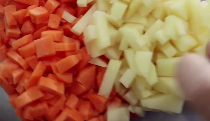 Add 2 large diced potatoes and 5 chopped carrots to the pan.