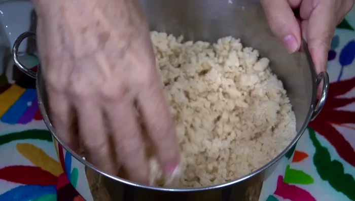 Gradually add milk until a soft dough forms that easily comes off your hands. Add more flour if the dough is too sticky.