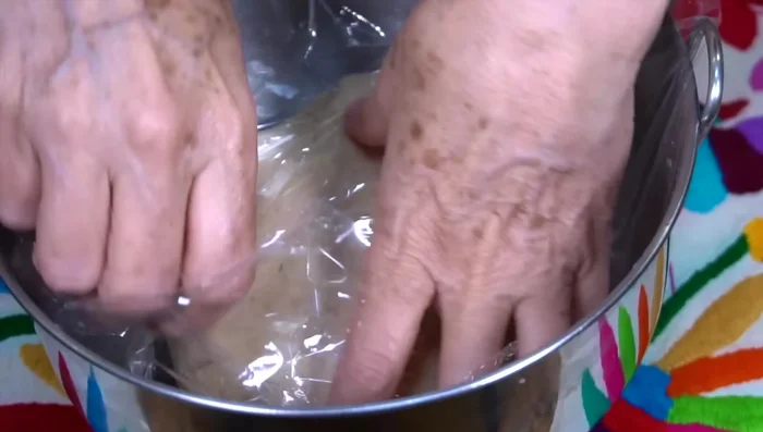 Cover the dough with plastic wrap and let it rest for at least half an hour.