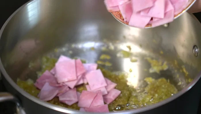 Add ham to the pan and cook until lightly browned.