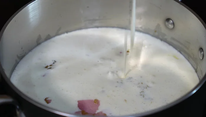 Pour in the blended cream sauce and stir well. Simmer until the cheese is melted.