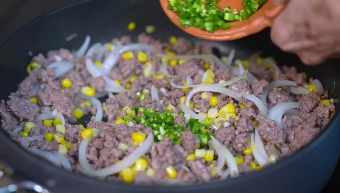 Add serrano pepper (optional) and fry for 1 minute.