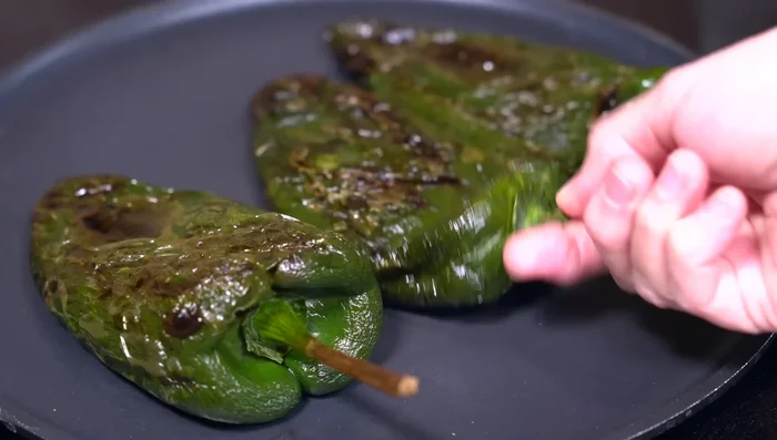 Roast poblano peppers (lightly oiled) until blistered, then sweat in a plastic bag to easily peel.