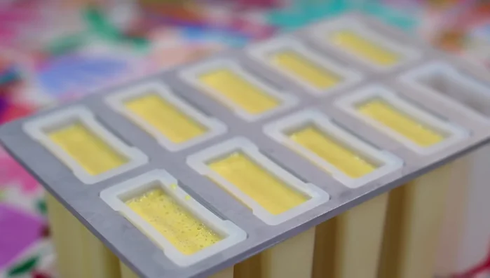 Insert popsicle sticks, then freeze for at least 6 hours or overnight.