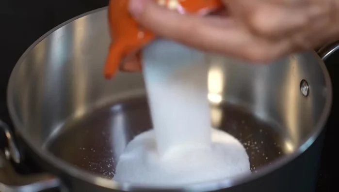 In a saucepan, combine sugar, salt, and milk (whole milk or a mixture of whole and evaporated milk). Stir to dissolve and heat over medium-low heat.