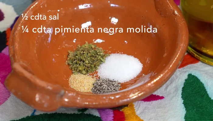 Season the nopales: In a bowl, mix olive oil, salt, pepper, garlic powder, and oregano.