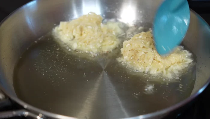Form the potato mixture into small pancakes and fry for 3-5 minutes per side, or until golden brown and cooked through.