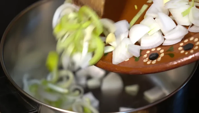 Sauté onion, garlic, and bay leaf in hot oil until softened (5-6 minutes).