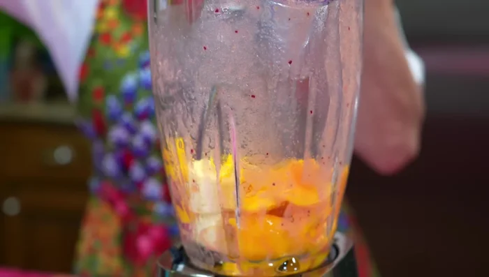 In the blender, combine the unstrained fruits (mango, banana, melon), evaporated milk, and condensed milk. Blend well.