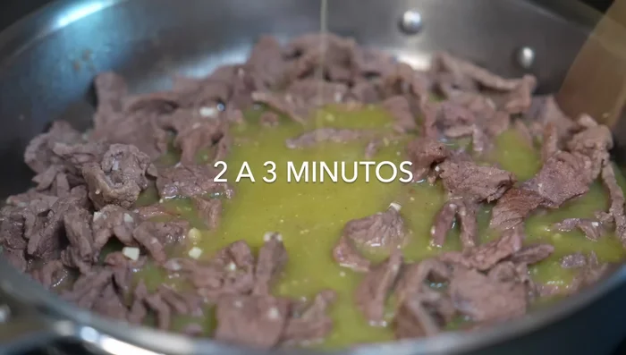 Add the blended tomato sauce, greens, and spices. Cook for 2-3 minutes. Add the chili sauce, season with salt, and lower heat.