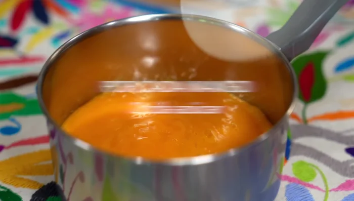Cook the mango puree with sugar in a saucepan until it boils, then simmer for 2-3 minutes.