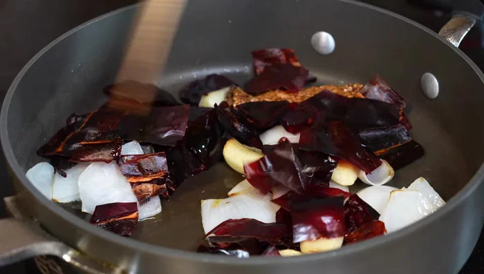 Add bay leaves, water and vinegar. Cover and simmer for 5-7 minutes until chiles are soft.