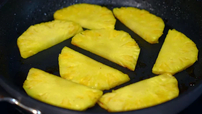 Grill pineapple slices briefly in the same pan.