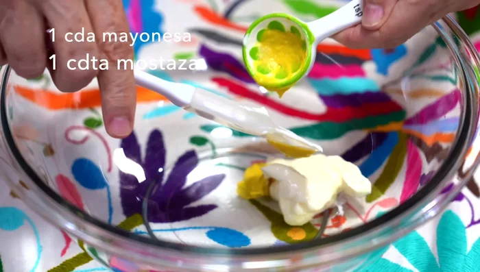 Prepare the dressing: In a container, mix mayonnaise, mustard, pressed garlic, oregano, salt, pepper, lemon juice, vinegar, and olive oil. Stir well.