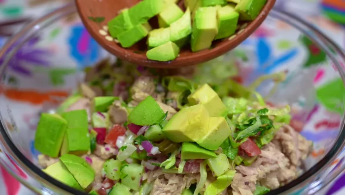 Gently fold in the diced avocado.