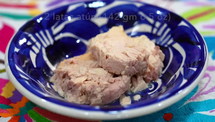 Drain two cans of tuna.