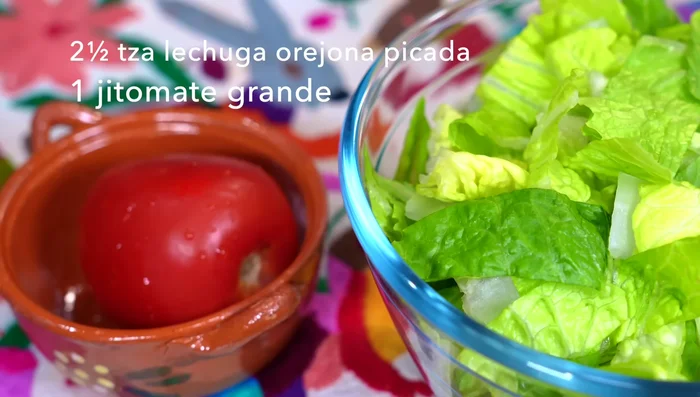 Chop the tomato into cubes.