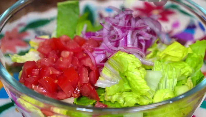 Combine the tomato, marinated onion (without vinegar), cucumber, cilantro, surimi, and pickled jalapeños in a bowl.