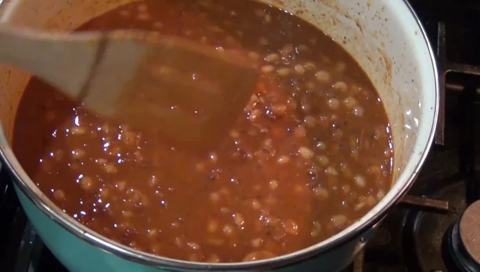Let the beans and chorizo simmer for a while, then mash them. You can also blend the beans for a smoother consistency.