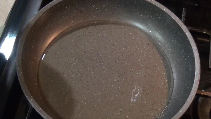 Heat a little oil in a pan and fry the tortillas until slightly crispy.