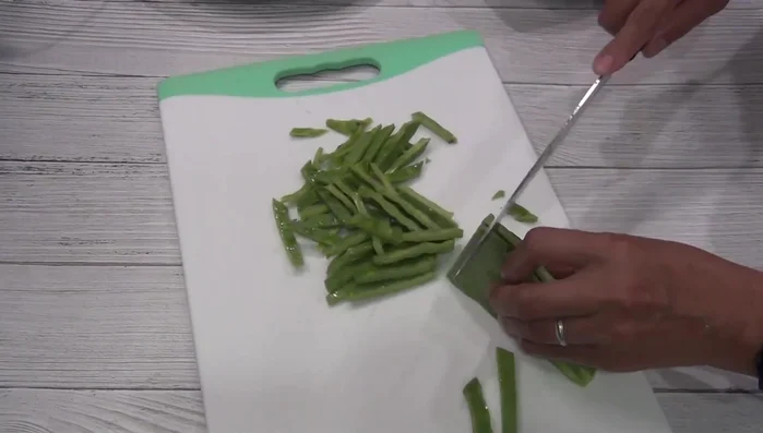 Cut the nopales. Boil them in water with salt and onion until tender.