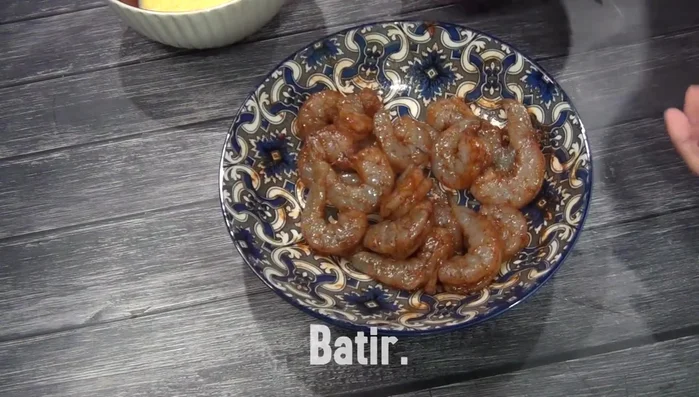Prepare three plates: one with flour, one with the egg mixture, and one with breadcrumbs.