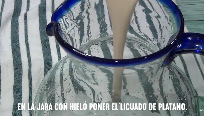 Pour the mixture into a glass filled with ice.