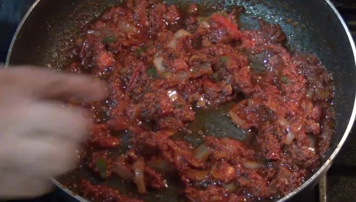 Add the fried tortilla chips to the pan with the chorizo mixture. (Around 234.84)