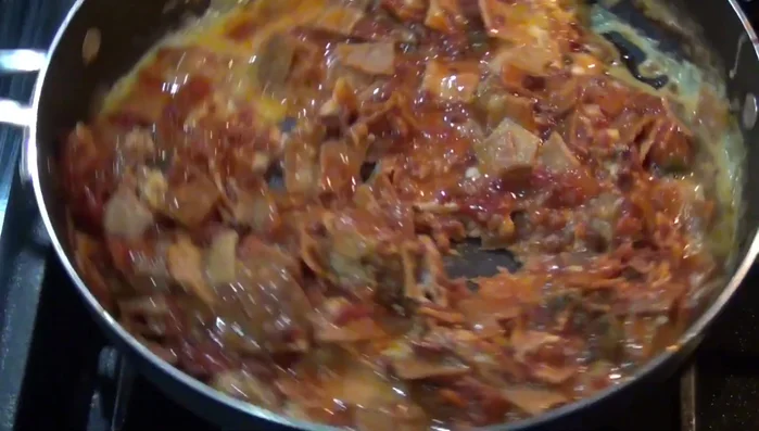 Stir the mixture gently until the eggs are cooked through and the tortillas are golden brown. (Around 276.95)