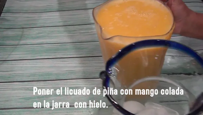 Pour the strained mixture into a pitcher with ice.