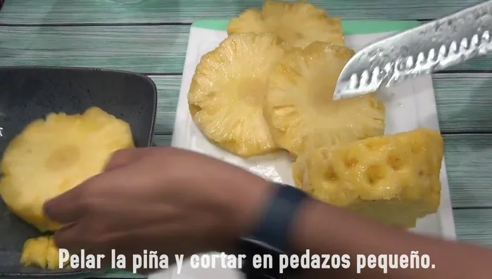 Cut the pineapple. Remove the pulp.