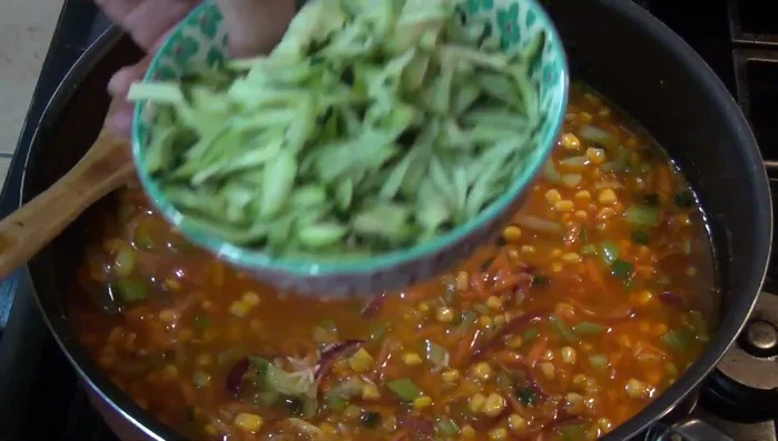 Add the grated zucchini and stir.