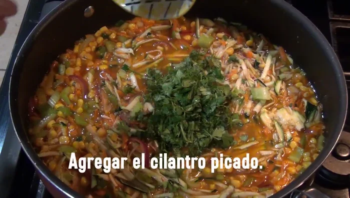 Add the cilantro, parsley, and chicken broth.