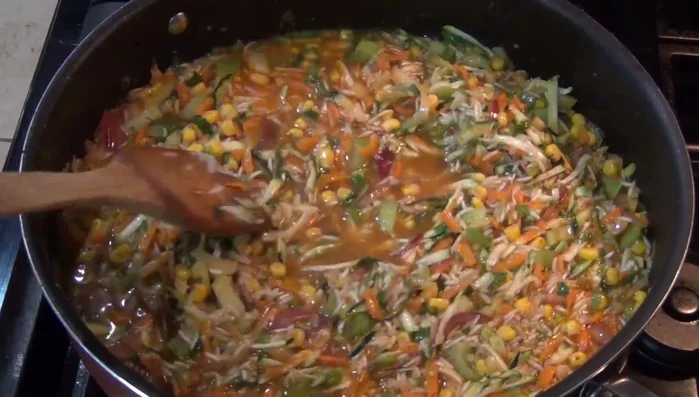 Add the cooked shrimp to the rice mixture.