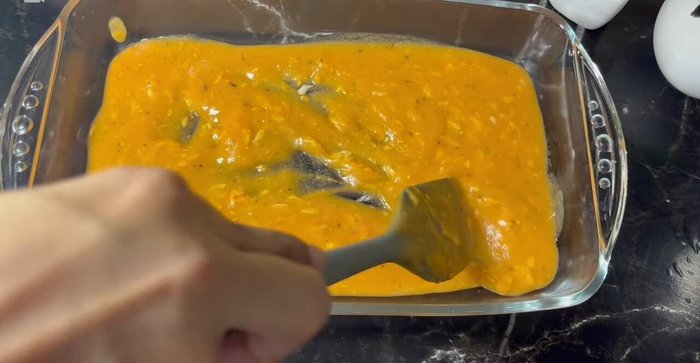 Spread some of the sauce in a heat-resistant pan. Fill each tortilla with the beef mixture and shredded cheese, roll tightly, and place seam-down in the pan.